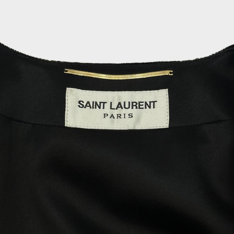 Saint Laurent black velvet dress with white lace details at the cuffs