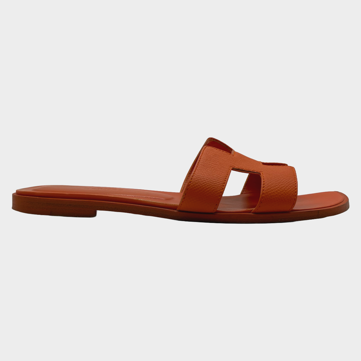 Hermes women s orange sunset leather Oran sandal Loop Generation