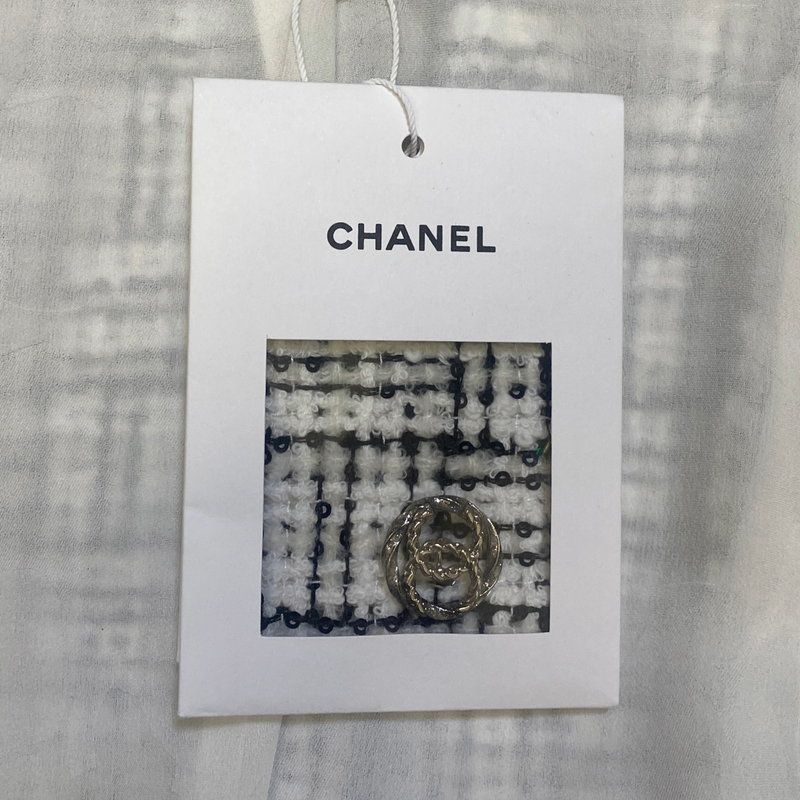 Chanel women's black and white tweed jacket with silver buttons