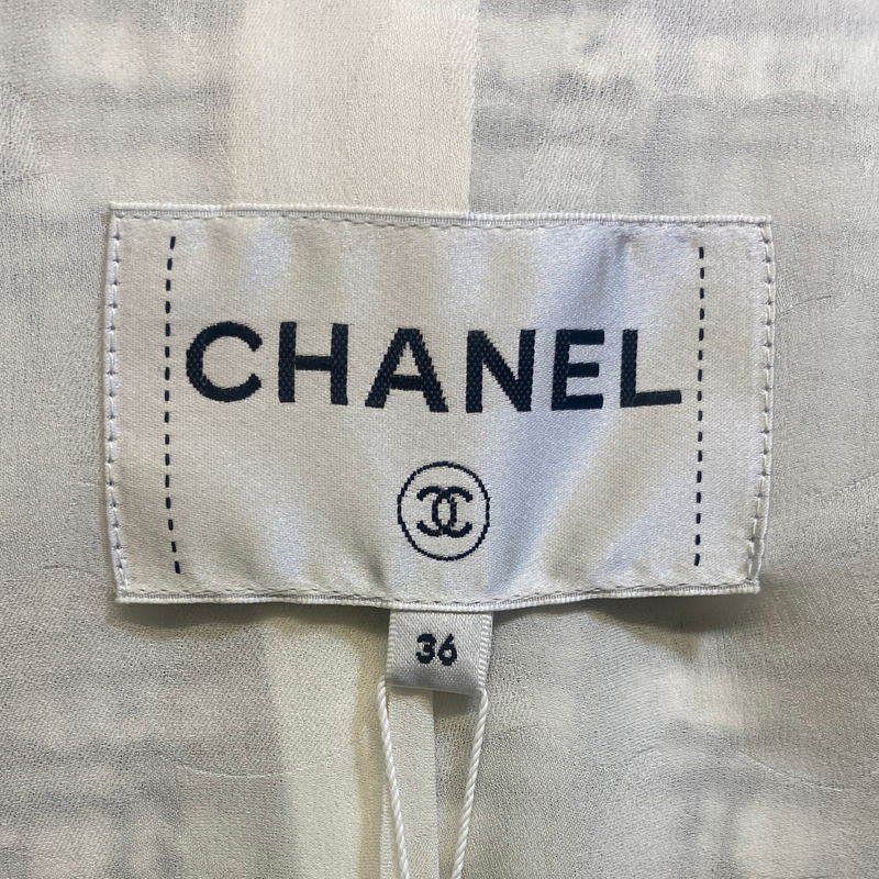 Chanel women's black and white tweed jacket with silver buttons