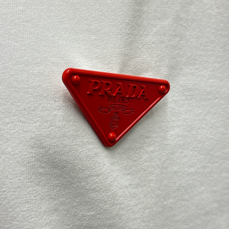 Prada men's t-shirt with a red logo pin