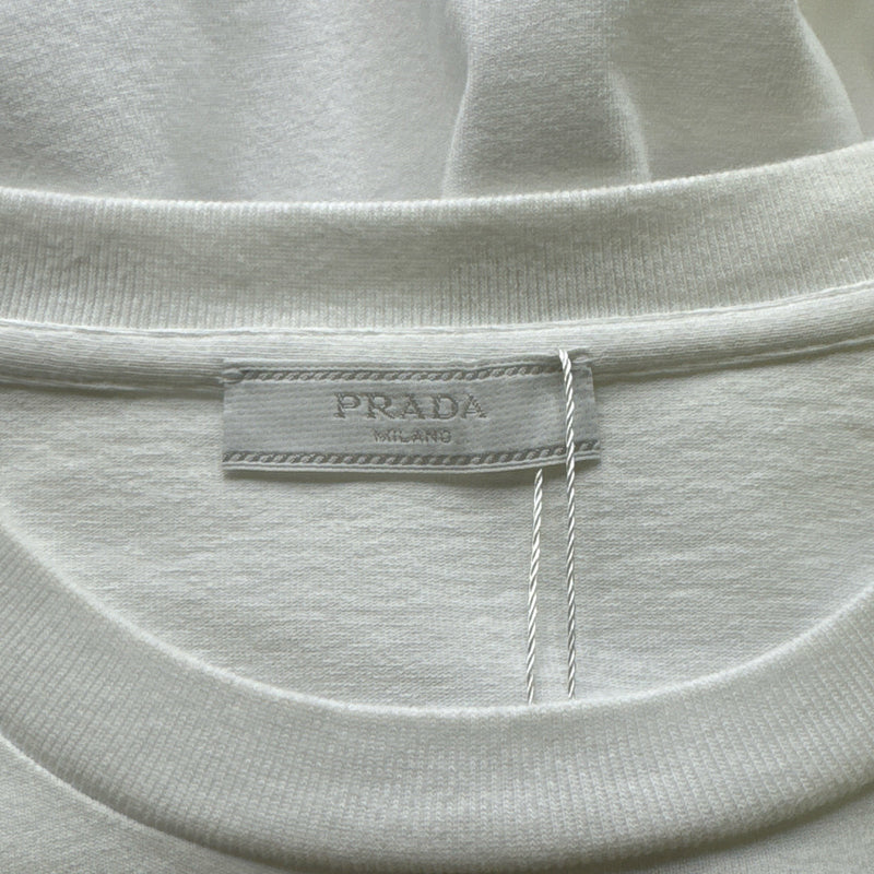 Prada men's t-shirt with a red logo pin