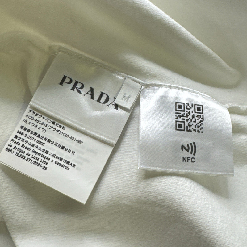 Prada men's t-shirt with a red logo pin