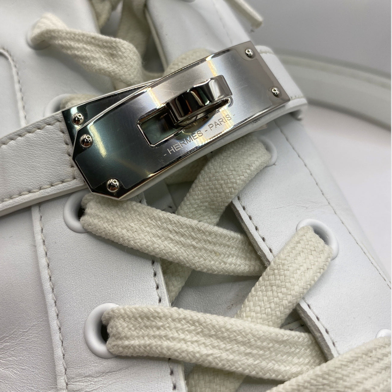 Hermes men s white calfskin sneakers with silver Kelly buckle