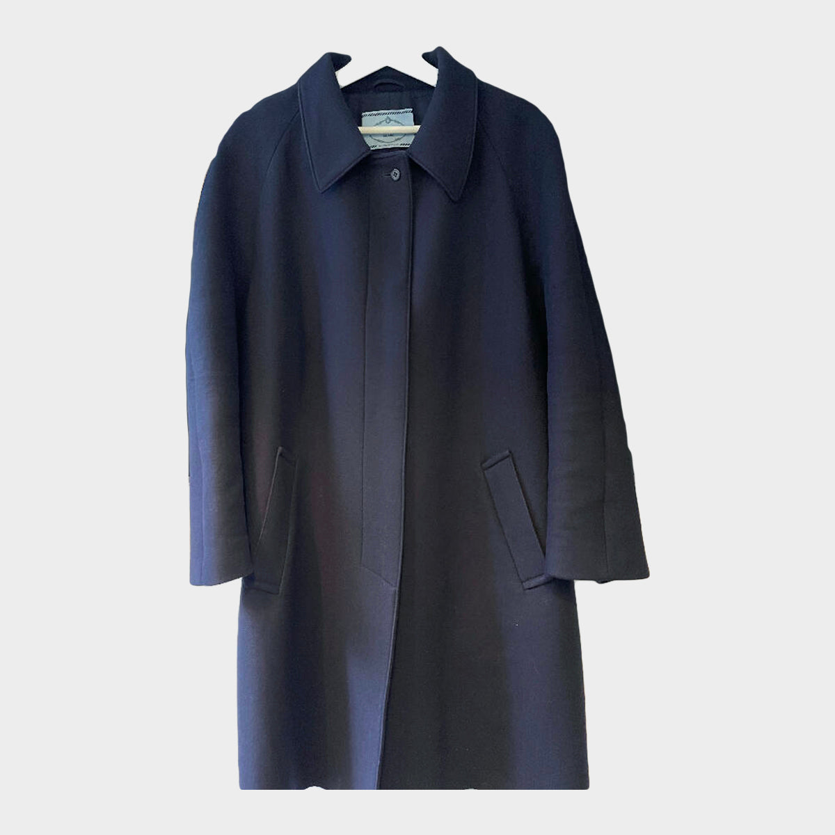 Prada women s navy wool coat with logo in mint fur trim at the back Loop Generation