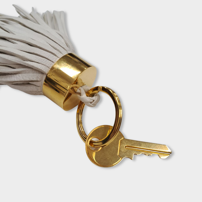 pre-loved TOM FORD ecru leather tassel keychain with gold key detail